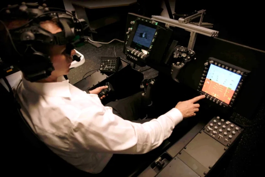 Person working at a flight simulator