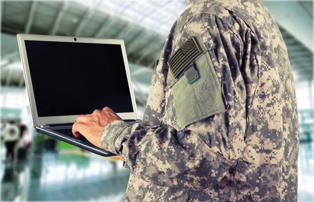 Soldier working at laptop