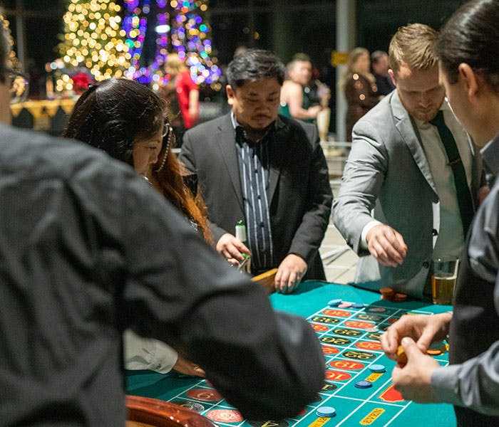 Employees playing casino games at company event
