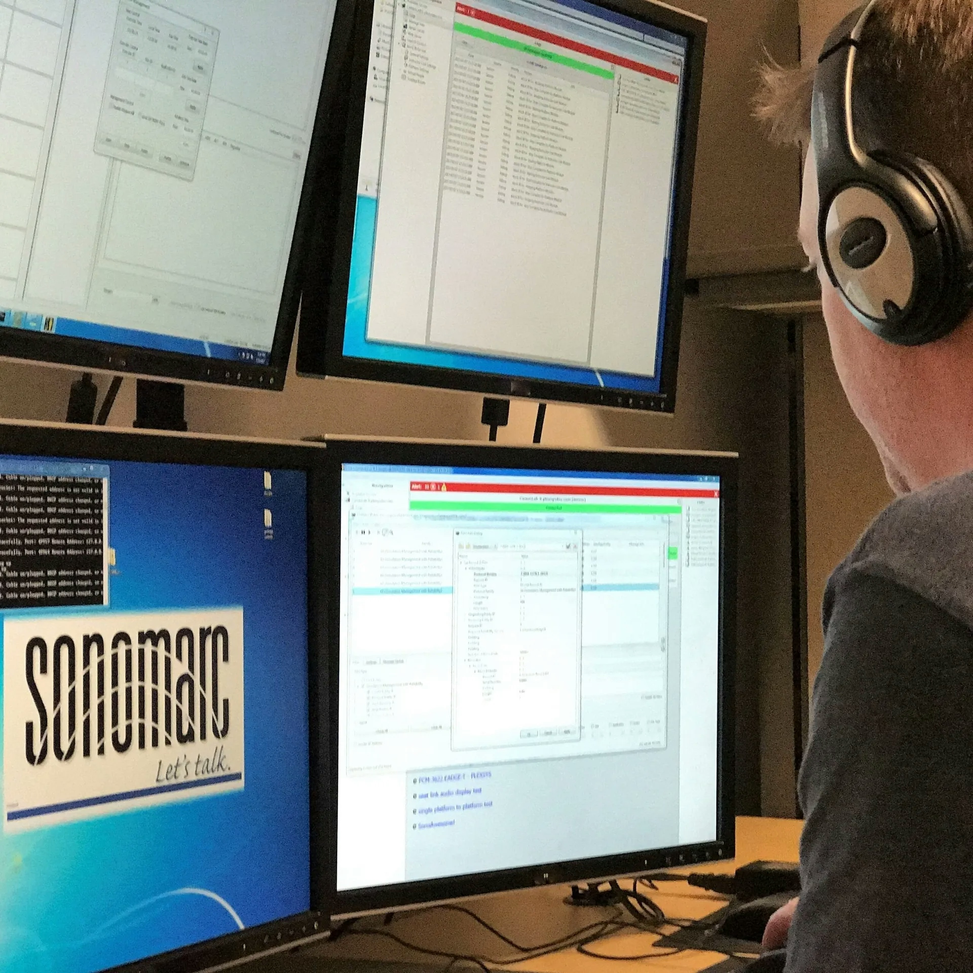 Person wearing a headset at a sonomarc console