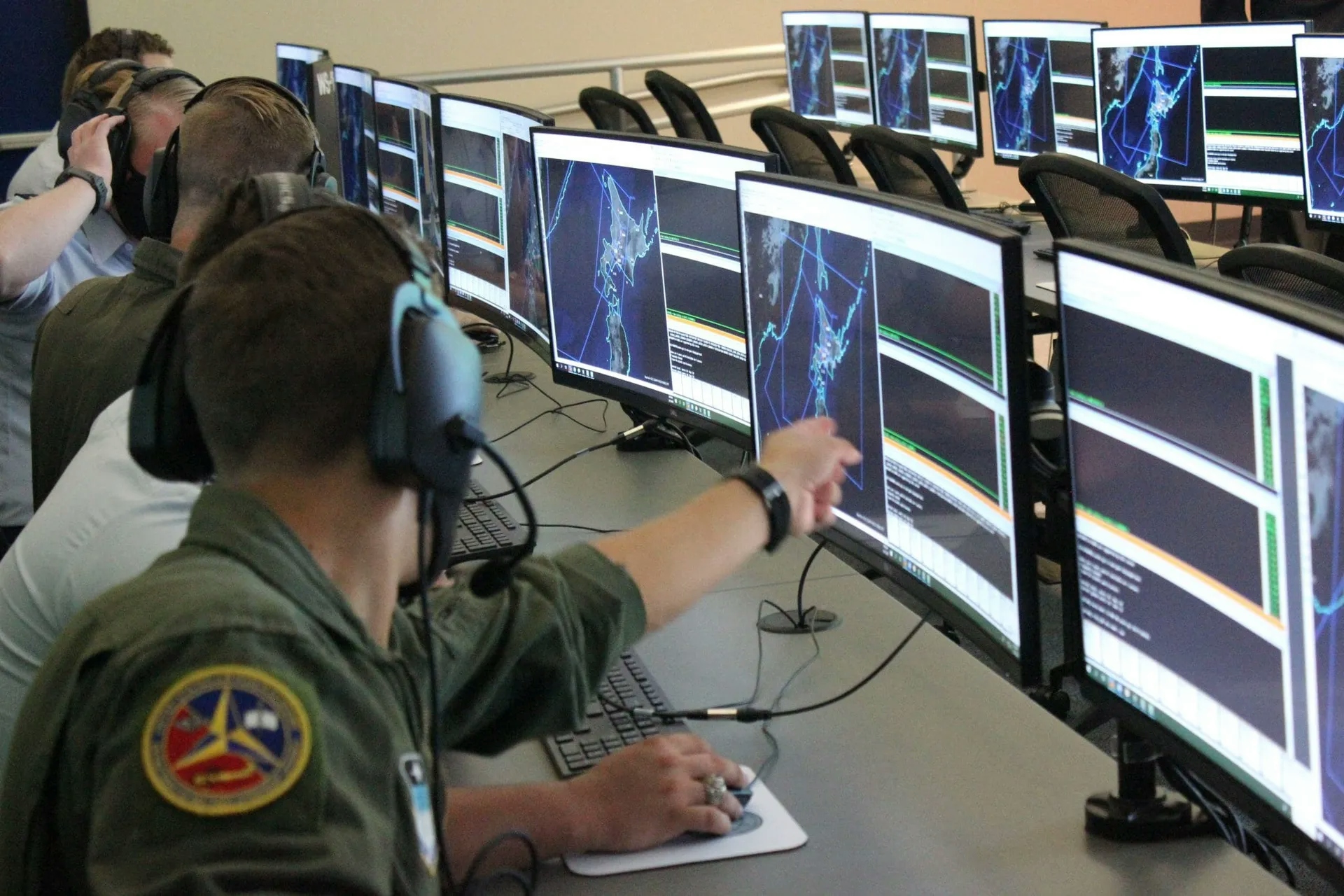 Soldiers working on screens at the MDL